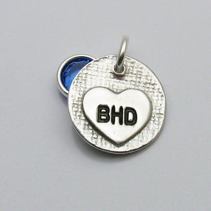Back of Circle Fingerprint Pendant with Swarovski Birthstone Charm showing heart engraved with initials