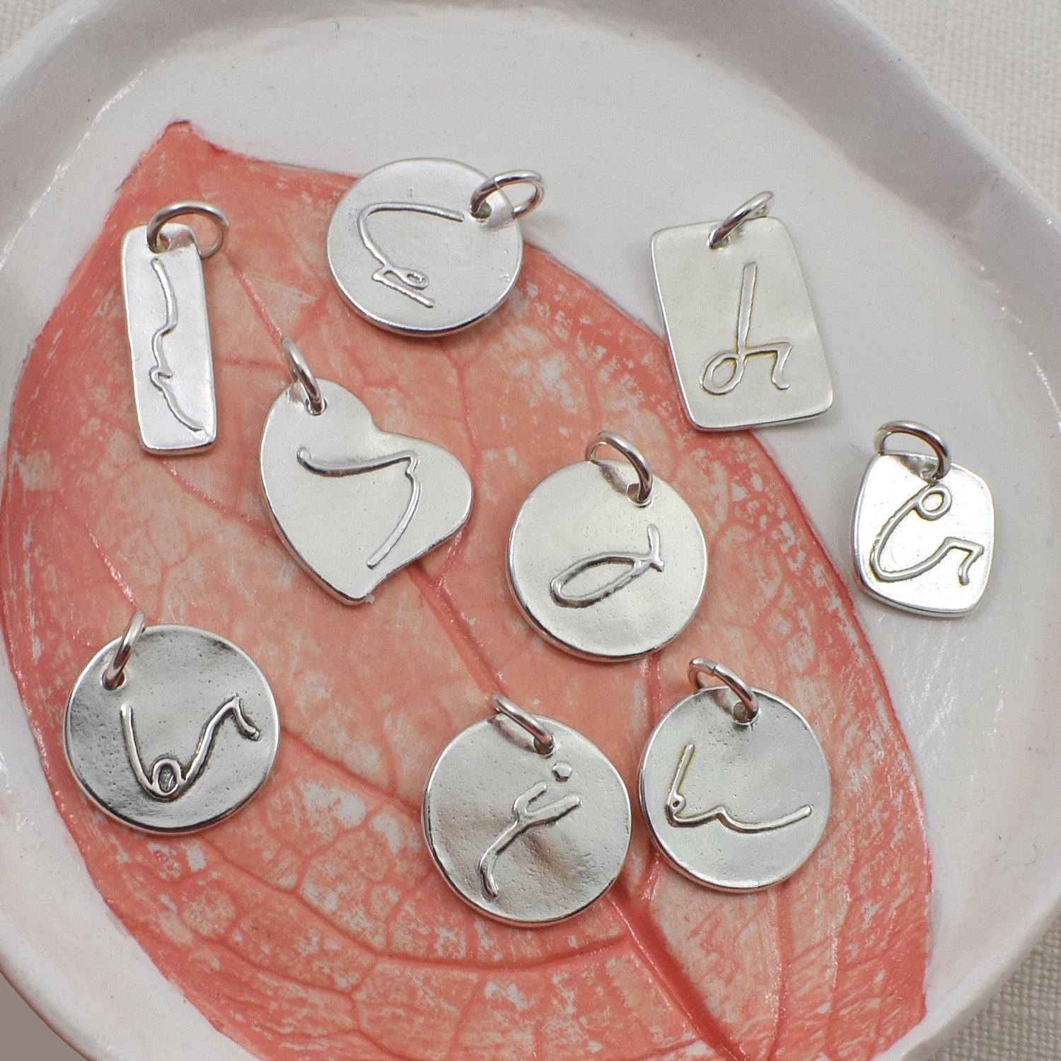 Whispers of Meaning: The Shorthand Pendant Collection
