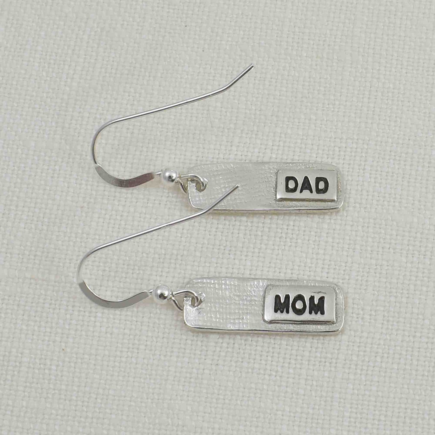 Back of Silver Fingerprint Bar Earrings showing thin engraved layer