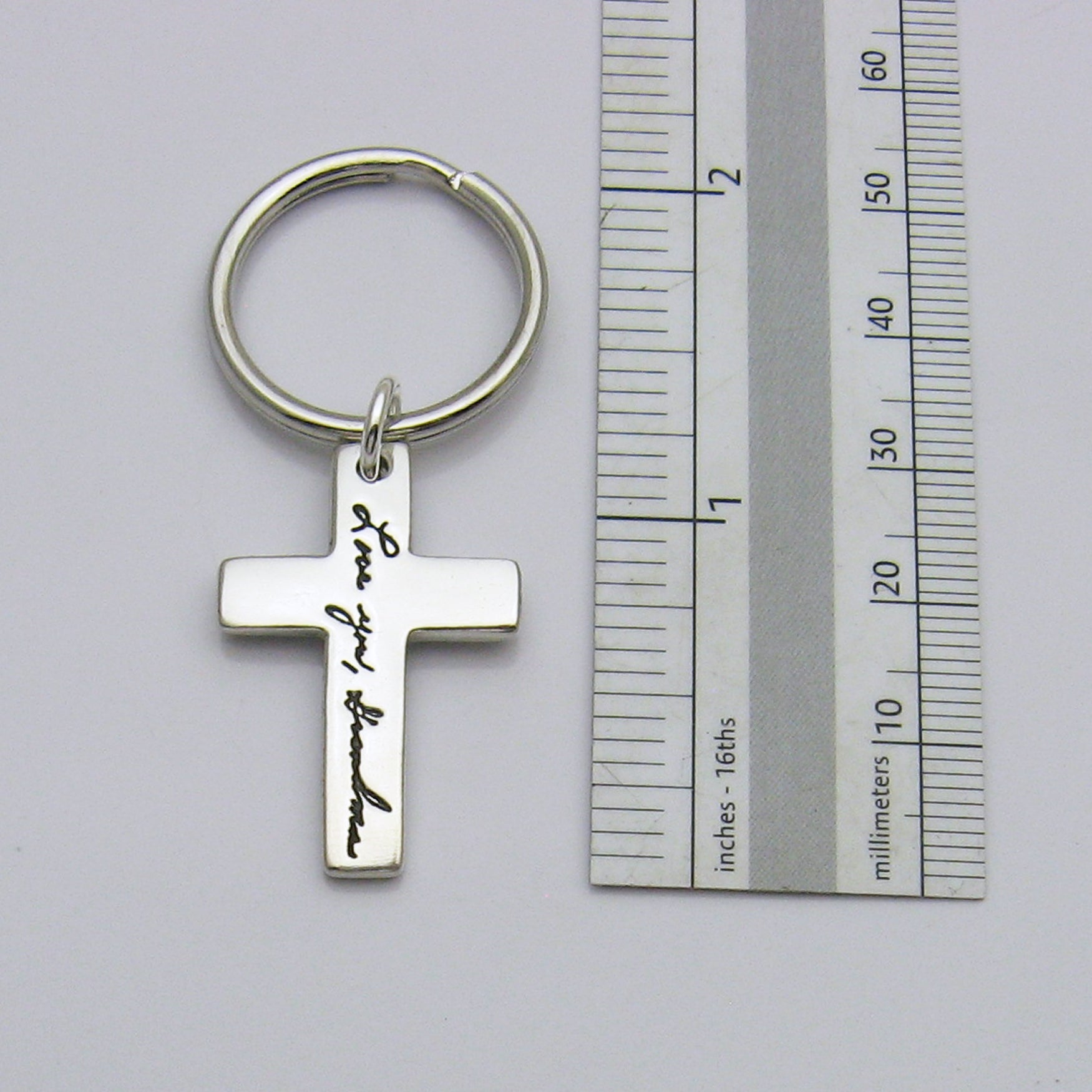 Cross Handwriting Keychain Next to Ruler for Size Reference