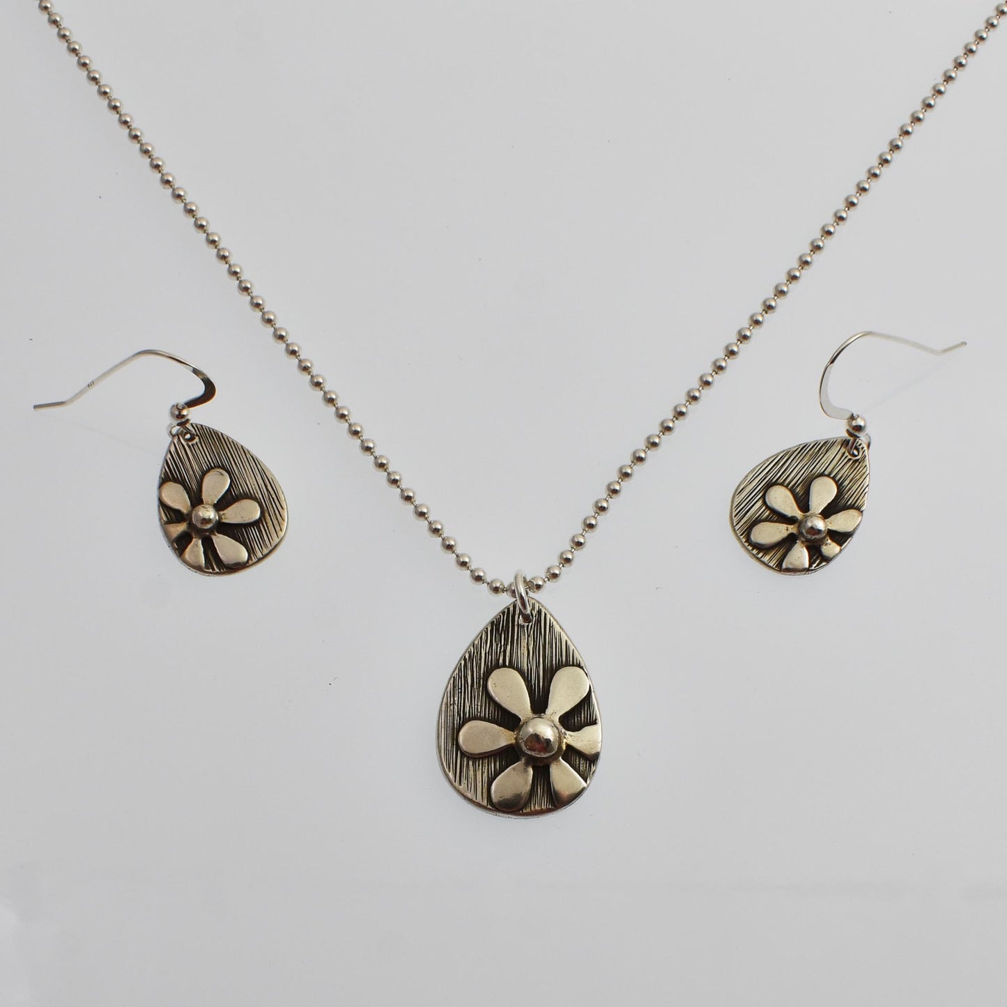 Silver Daisy Flower Teardrop Necklace shown with matching earrings that are available separately.  