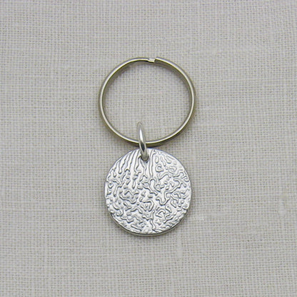 Dog Nose Textured Circle keychain showing example of pendant engraved with texture and all silver
