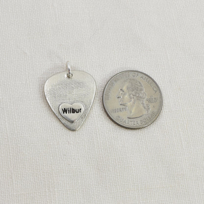 Dog Nose Guitar Pick Pendant back and shown with quarter for size reference