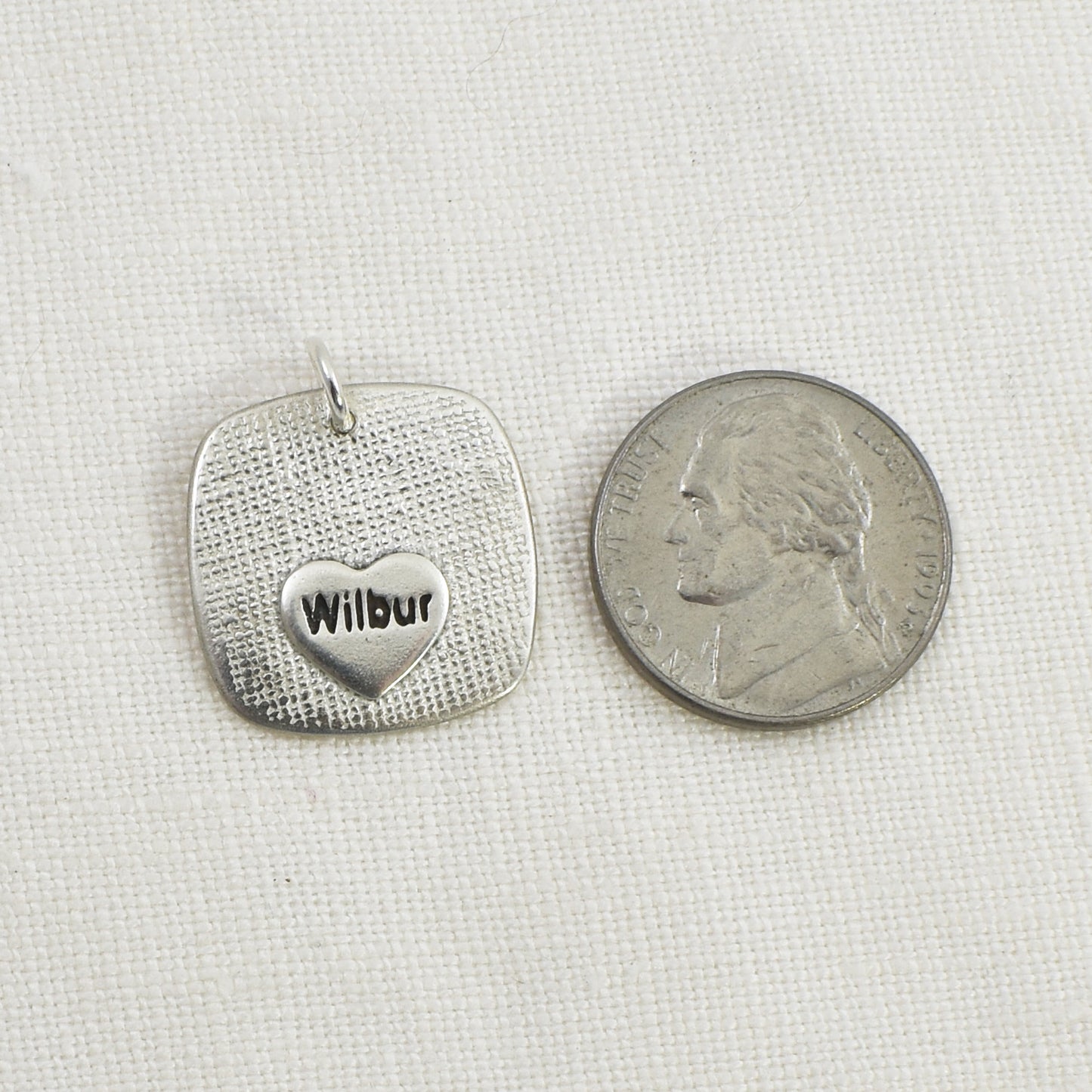 Dog Nose Rounded Square Pendant back and shown with nickel for size reference