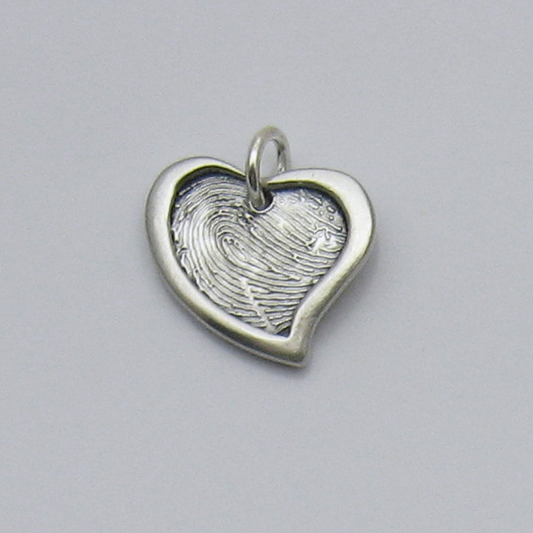 Assymetrical Heart Fingerprint Pendant With Raised Border 