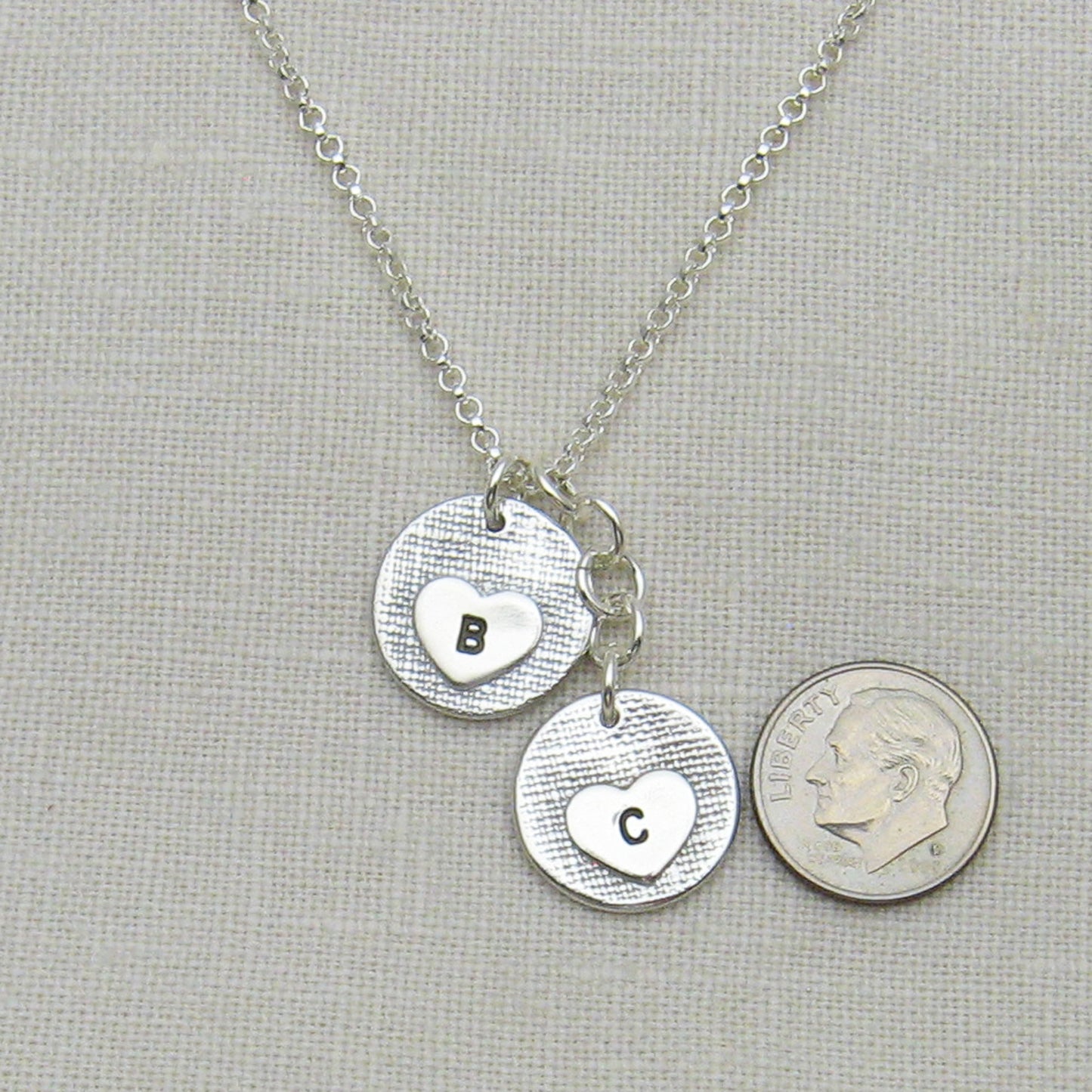 Circle Fingerprint Charm Necklace with two 5/8" circle charms Back of Charms  Showing hearts engraved with initials