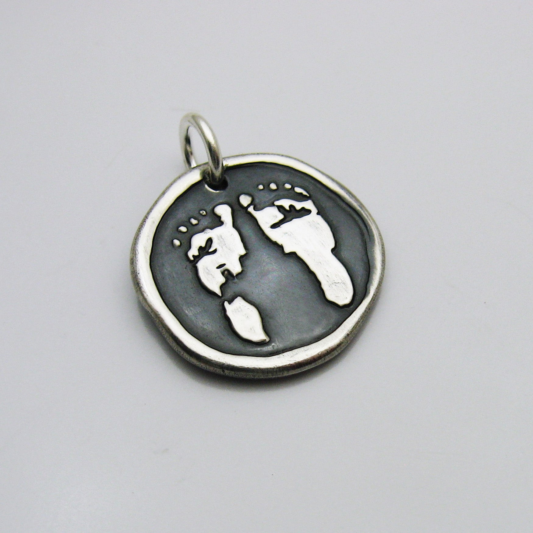 Embossed Footprint Pendant 