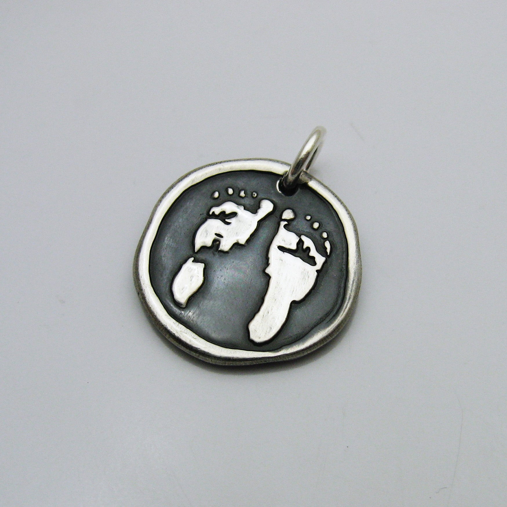 Embossed Footprint Pendant 