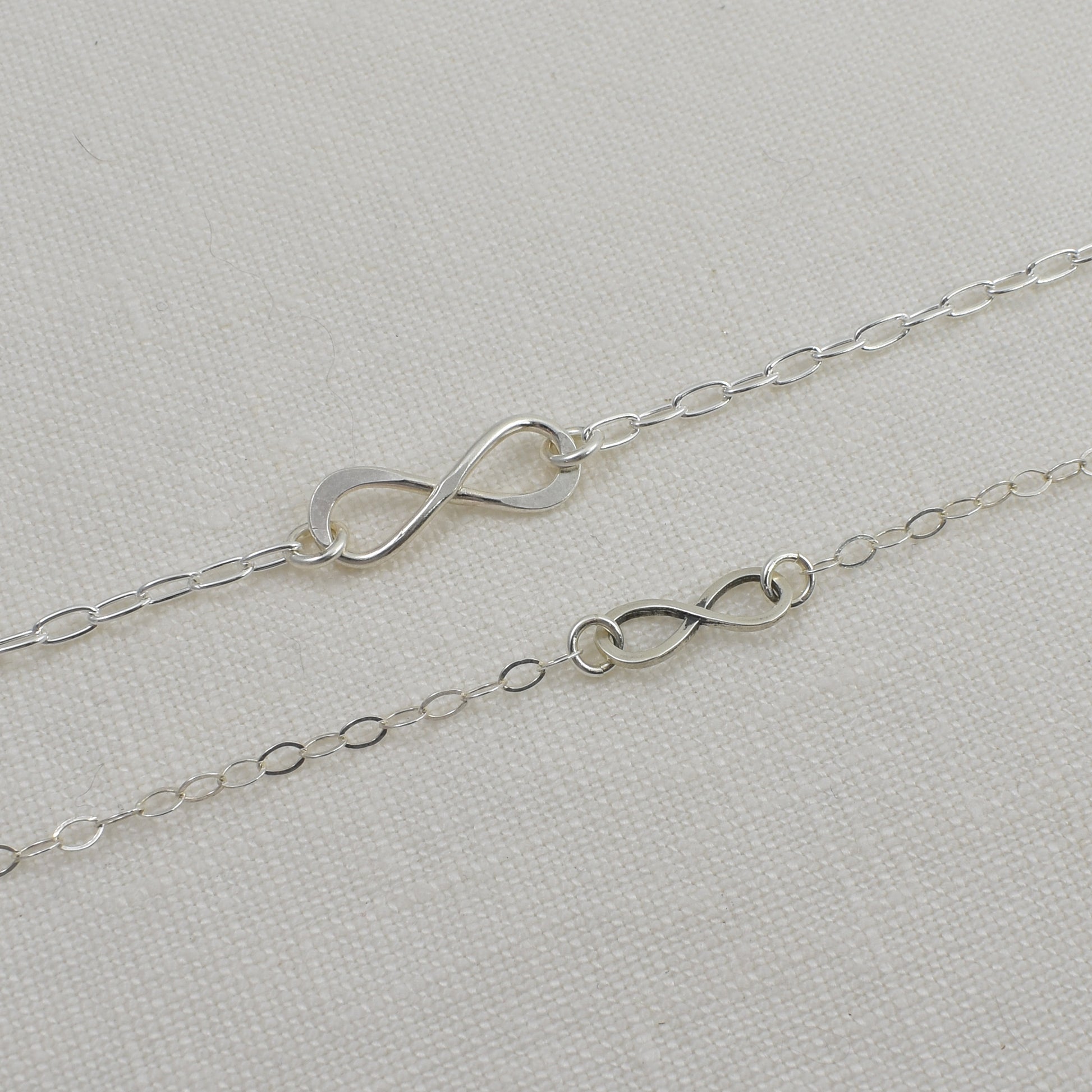 Sterling Silver Infinity Bracelets are shown together in the photo for size reference