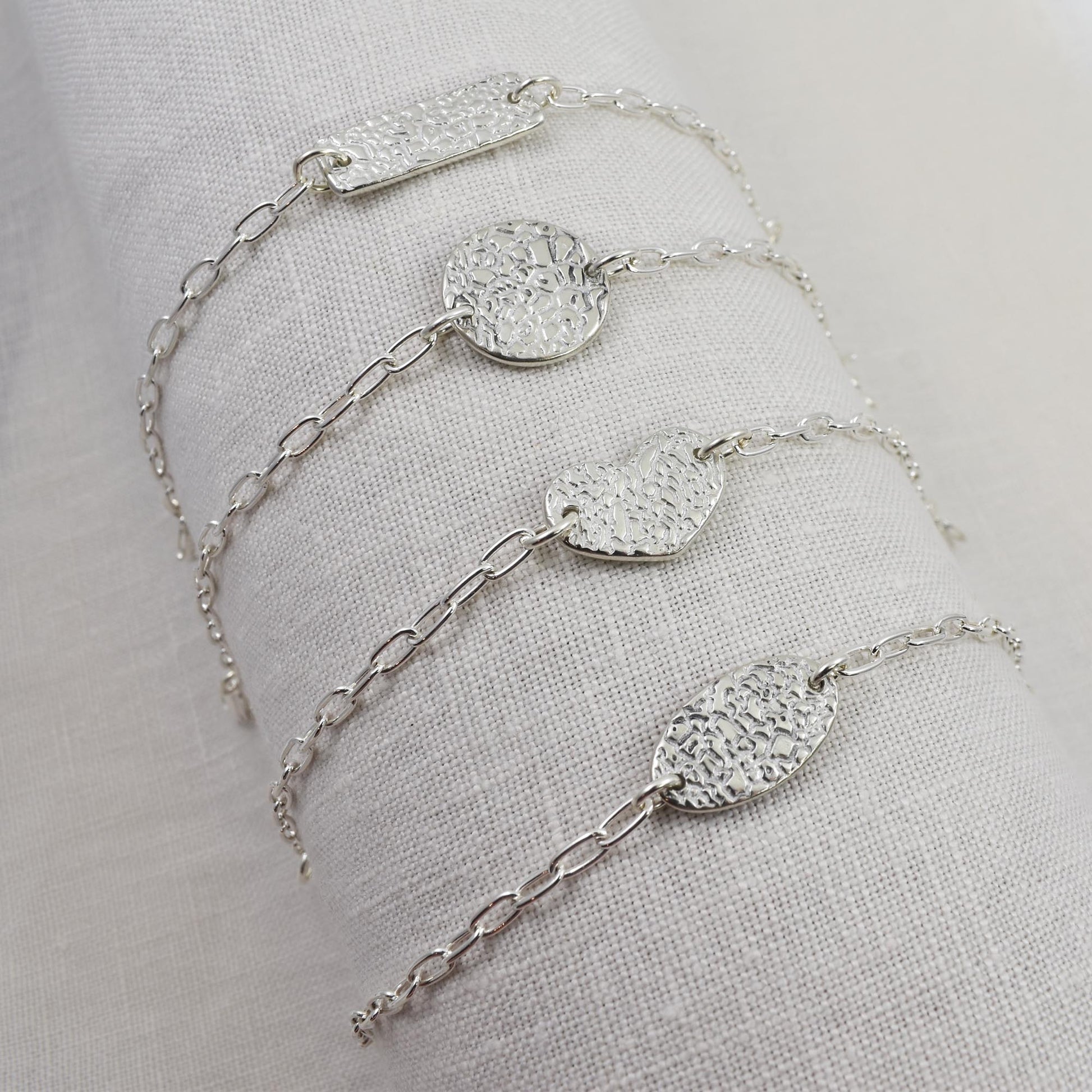 Dog Nose Texture Bracelet, Linked Memories Collection.  Bar, Circle, Heart and Oval Links are shown.  