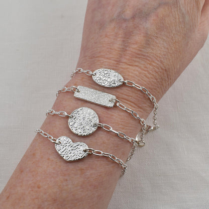 Dog Nose Texture Bracelet, Linked Memories Collection.  Bar, Circle, Heart and Oval Links are shown on wrist.  