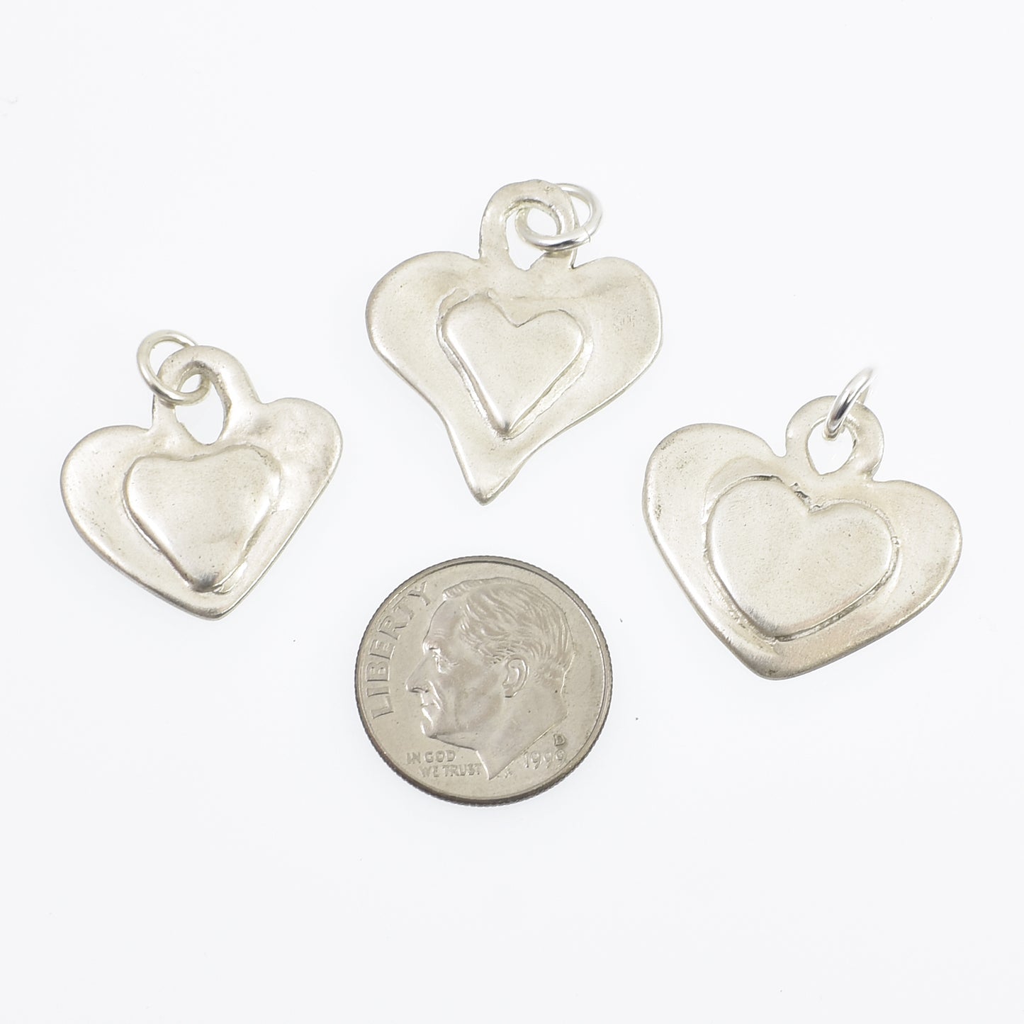 Sterling Silver Heart on Heart Charms All 3 charms next to dime for size reference