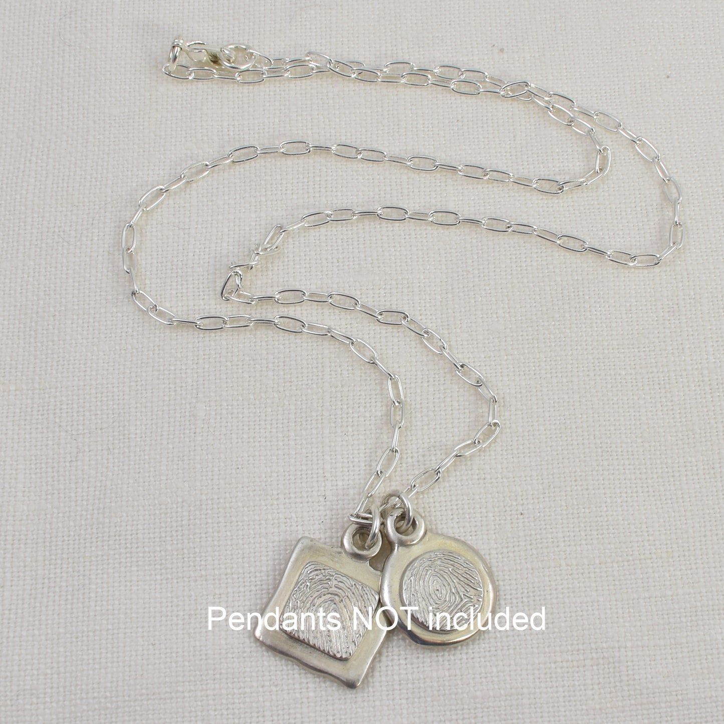 Sterling Silver Paperclip Chain shown with pendants, which are not included