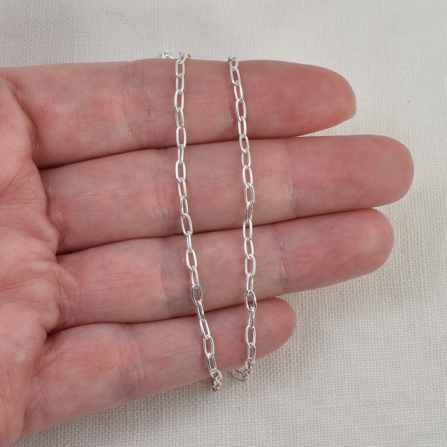 Sterling Silver Paperclip Chain shown on hand for size reference