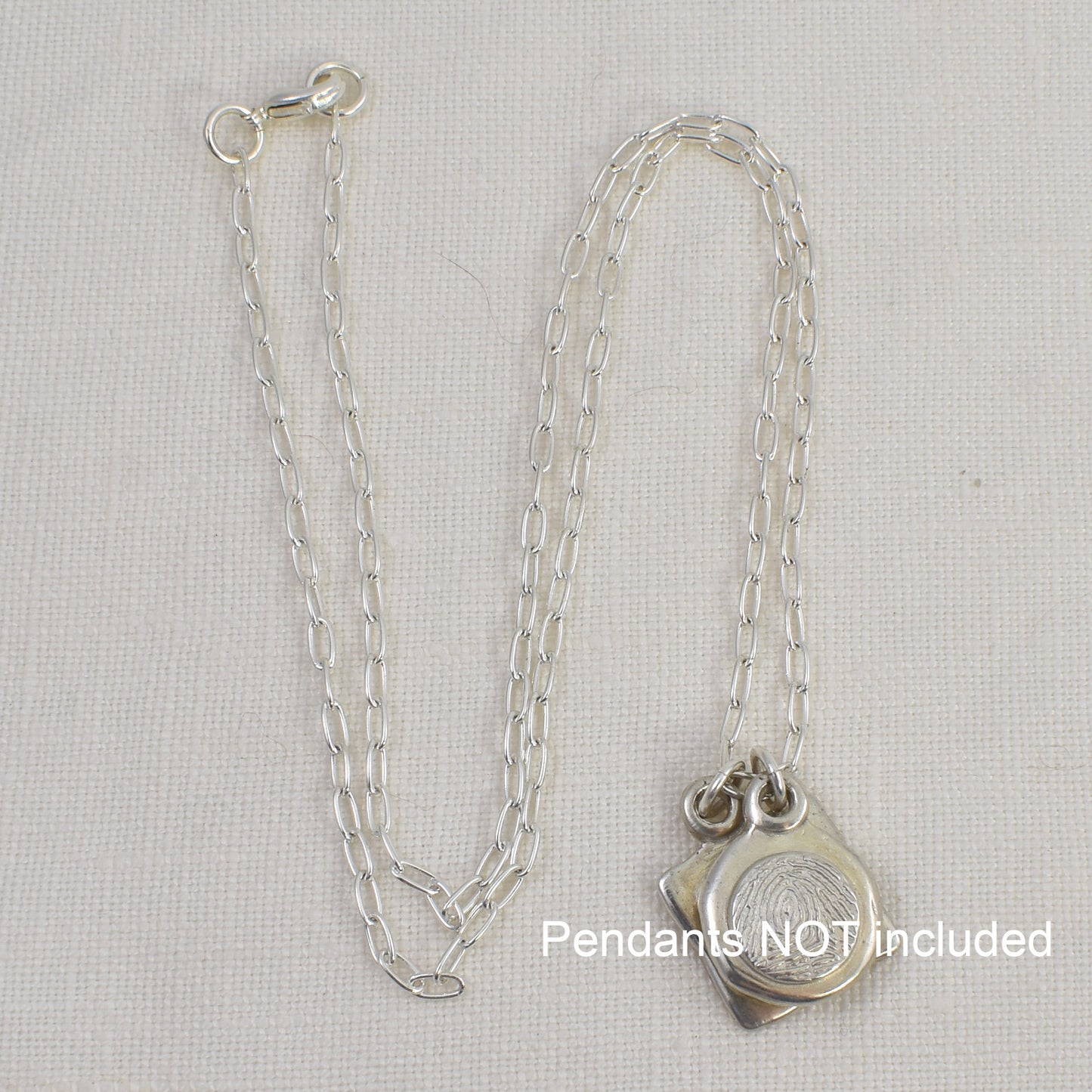 Sterling Silver Paperclip Chain shown with pendants which are not included.