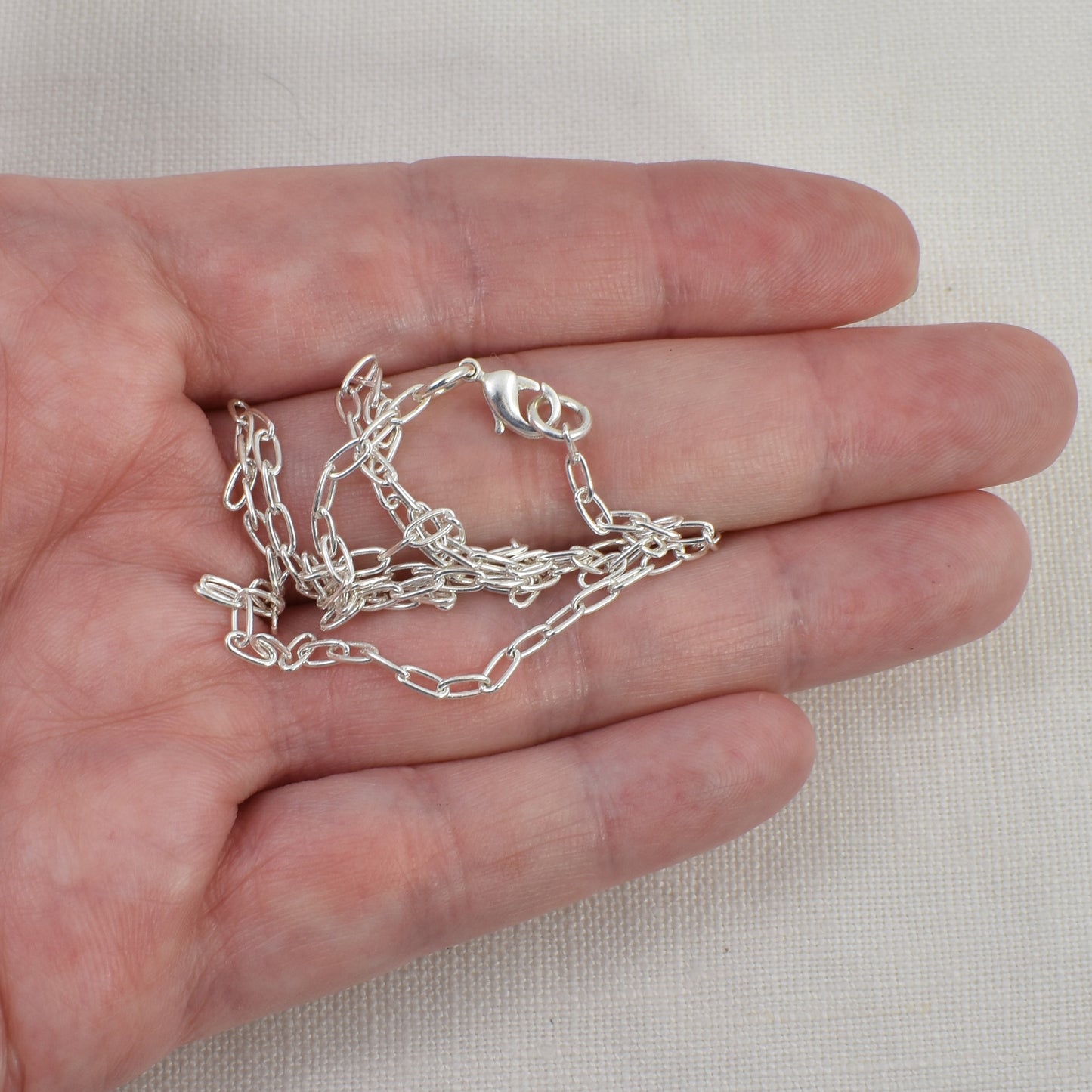 Sterling Silver Paperclip Chain  shown on a hand for size reference