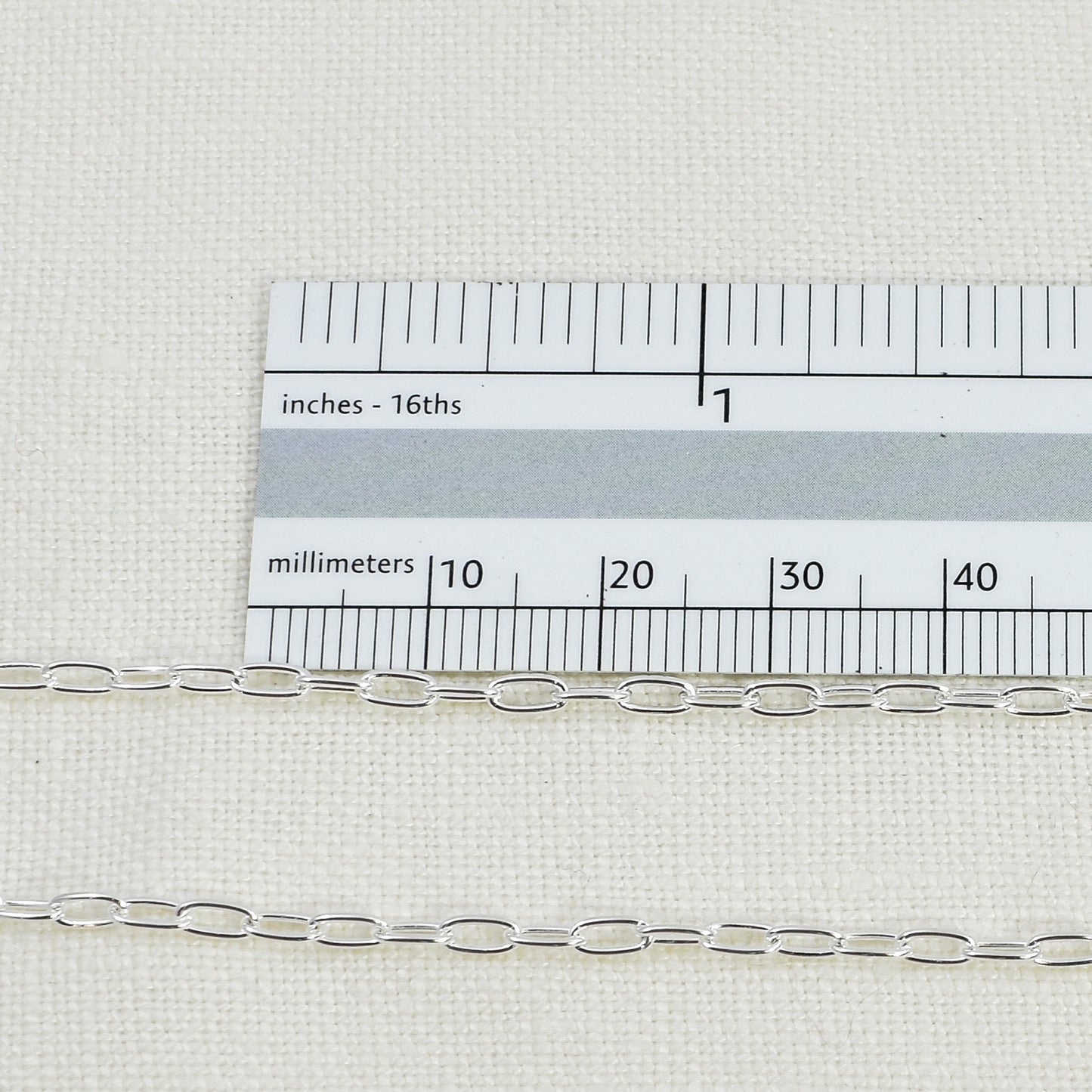 Sterling Silver Paperclip Chain shown next to a ruler for size reference