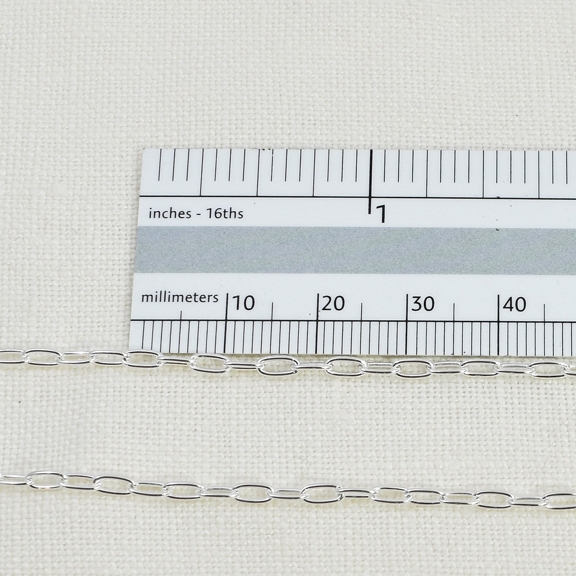 Sterling Silver Paperclip Chain shown next to a ruler for size reference