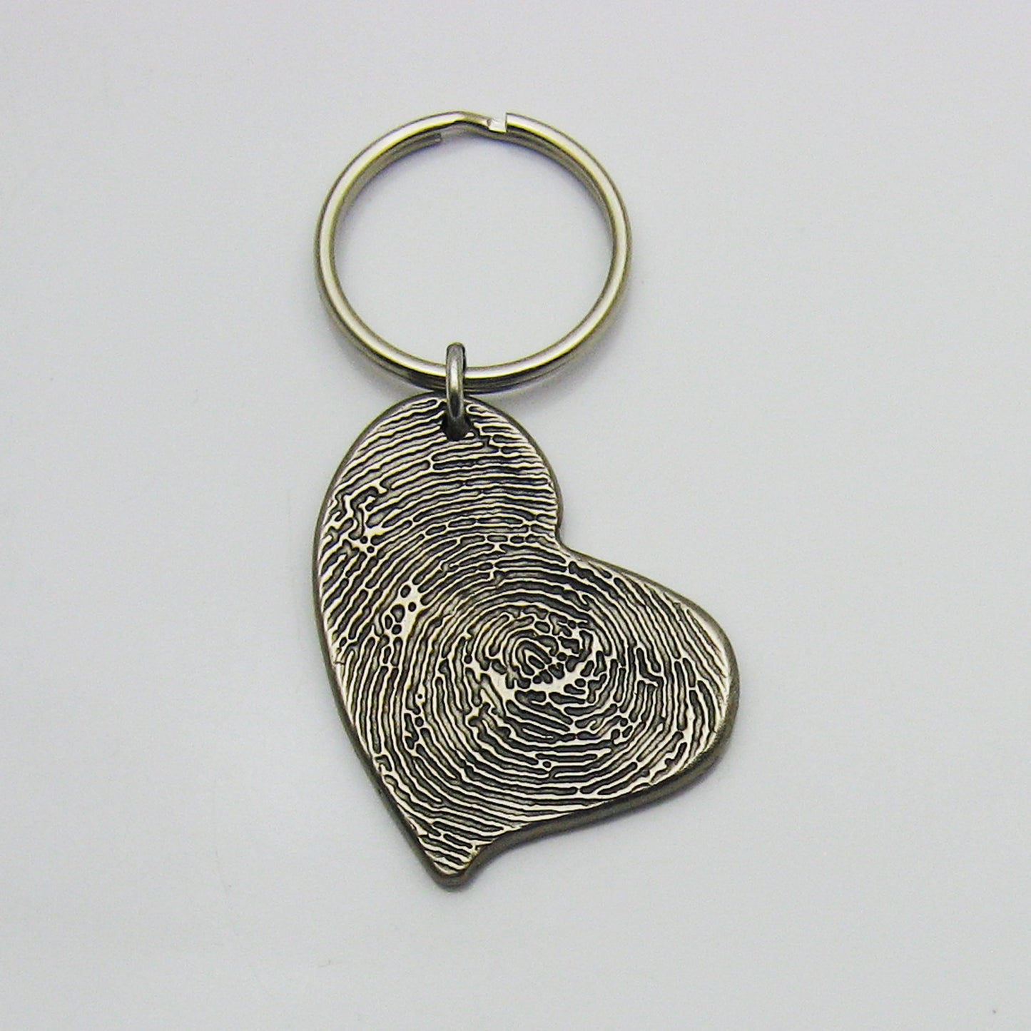 Rustic Metal Asymmetrical Heart Fingerprint Keychain